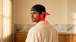 Man wearing RadianceCap with soft red glow